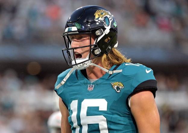 Aug 26, 2023; Jacksonville, Florida, USA; Jacksonville Jaguars quarterback Trevor Lawrence (16) reacts to a touchdown during the second quarter of the game against the Miami Dolphins at EverBank Stadium. Mandatory Credit: Melina Myers-USA TODAY Sports