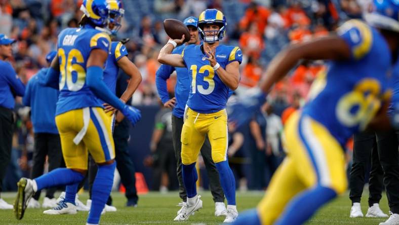 Aug 26, 2023; Denver, Colorado, USA; Los Angeles Rams quarterback Stetson Bennett (13) warms up before the game against the Denver Broncos at Empower Field at Mile High. Mandatory Credit: Isaiah J. Downing-USA TODAY Sports