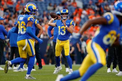 Aug 26, 2023; Denver, Colorado, USA; Los Angeles Rams quarterback Stetson Bennett (13) warms up before the game against the Denver Broncos at Empower Field at Mile High. Mandatory Credit: Isaiah J. Downing-USA TODAY Sports
