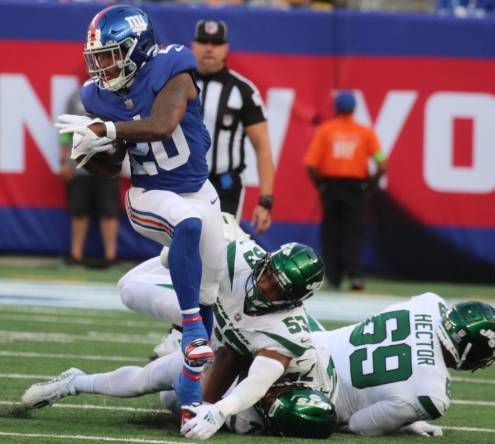 East Rutherford, NJ August 26, 2023 -- Amani Oruwariye of the Giants runs the ball in the first half. The NY Jets against the NY Giants on August 26, 2023 at MetLife Stadium in East Rutherford, NJ, as the rivals play their final preseason game before the start of the NFL season.
