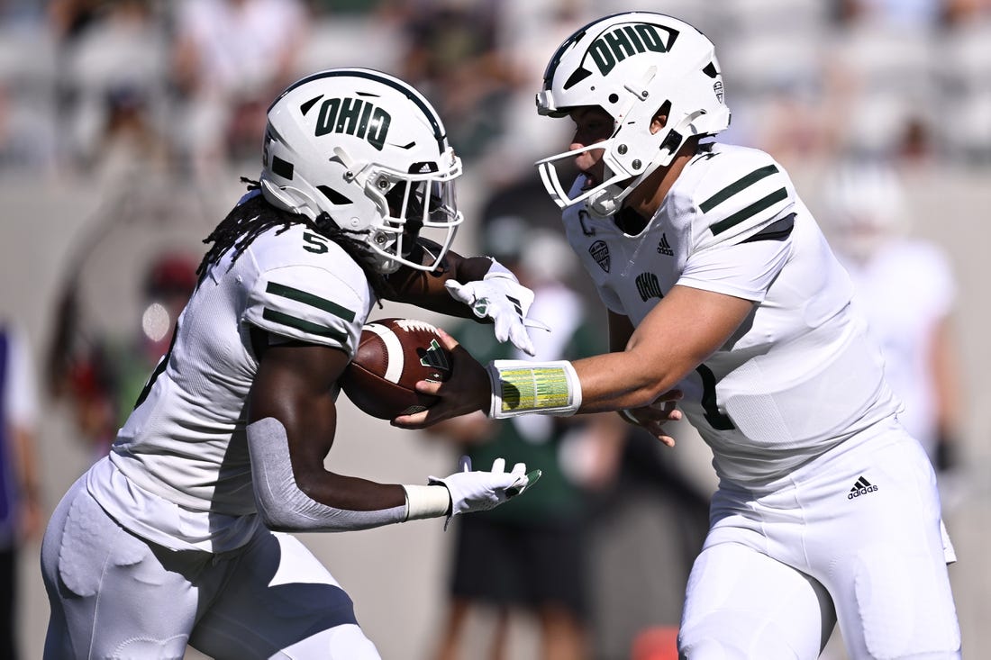 Aug 26, 2023; San Diego, California, USA; Ohio Bobcats quarterback Kurtis Rourke (7) hands off to running back Sieh Bangura (5) during the first half against the San Diego State Aztecs at Snapdragon Stadium. Mandatory Credit: Orlando Ramirez-USA TODAY Sports