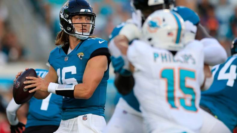 Jacksonville Jaguars quarterback Trevor Lawrence (16) looks to pass during the first quarter of a preseason matchup Saturday, Aug. 26, 2023 at EverBank Stadium in Jacksonville, Fla. The game was suspended in the fourth after Miami Dolphins wide receiver Daewood Davis (87) was injured on a play with the Jaguars leading 31-18.