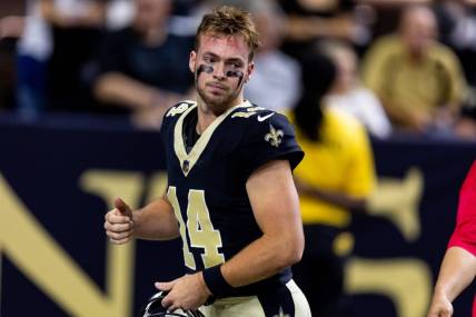 Aug 27, 2023; New Orleans, Louisiana, USA;  New Orleans Saints quarterback Jake Haener (14) against the Houston Texans during the first half at the Caesars Superdome. Mandatory Credit: Stephen Lew-USA TODAY Sports