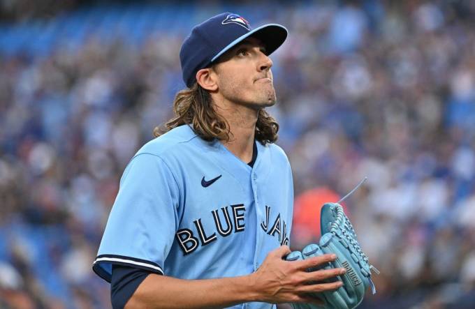 Aug 28, 2023; Toronto, Ontario, CAN;  Toronto Blue Jays starting pitcher Kevin Gausman (34) reacts after giving up a run to the Washington National in the first inning at Rogers Centre. Mandatory Credit: Dan Hamilton-USA TODAY Sports