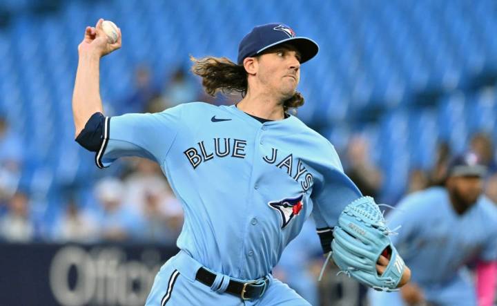 Aug 28, 2023; Toronto, Ontario, CAN;  Toronto Blue Jays starting pitcher Kevin Gausman (34) delivers a pitch against the Washington National in the first inning at Rogers Centre. Mandatory Credit: Dan Hamilton-USA TODAY Sports