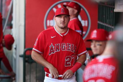 Aug 22, 2023; Anaheim, California, USA;  Los Angeles Angels center fielder Mike Trout (27) in the dugout before the game against the Cincinnati Reds at Angel Stadium. Mandatory Credit: Kiyoshi Mio-USA TODAY Sports