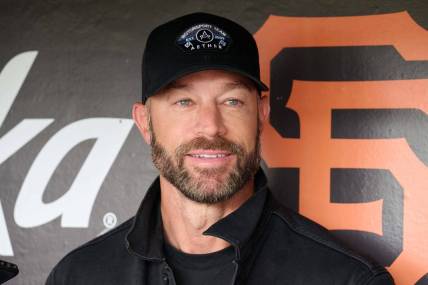 Aug 26, 2023; San Francisco, California, USA; San Francisco Giants manager Gabe Kapler (19) smiles in the dugout before the game against the Atlanta Braves at Oracle Park. Mandatory Credit: Robert Edwards-USA TODAY Sports