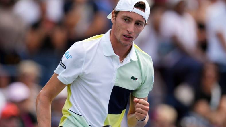 Aug 29, 2023; Flushing, NY, USA; Ugo Humbert of France wins a game in the first set against Matteo Berrettini of Italy on day two of the 2023 U.S. Open tennis tournament at USTA Billie Jean King National Tennis Center. Mandatory Credit: Danielle Parhizkaran-USA TODAY Sports