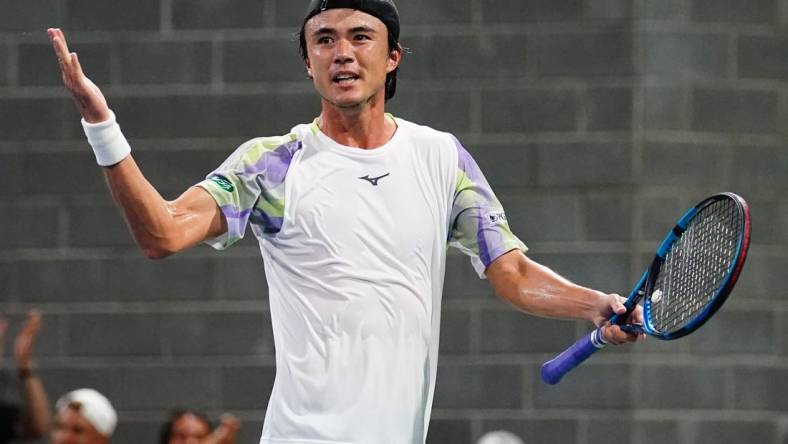 Aug 29, 2023; Flushing, NY, USA; Taro Daniel of Japan celebrates after winning a point against Gael Monfils of France on day two of the 2023 U.S. Open tennis tournament at the USTA Billie Jean King National Tennis Center. Mandatory Credit: Jerry Lai-USA TODAY Sports