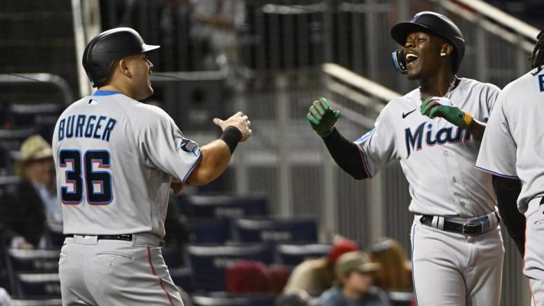 Aug 31, 2023; Washington, District of Columbia, USA; Miami Marlins center fielder Jazz Chisholm Jr. (2) celebrates with third baseman Jake Burger (36) after hitting a three run home run against the Washington Nationals during the fifth inning  at Nationals Park. Mandatory Credit: Brad Mills-USA TODAY Sports