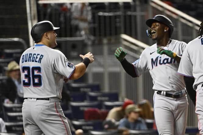 Aug 31, 2023; Washington, District of Columbia, USA; Miami Marlins center fielder Jazz Chisholm Jr. (2) celebrates with third baseman Jake Burger (36) after hitting a three run home run against the Washington Nationals during the fifth inning  at Nationals Park. Mandatory Credit: Brad Mills-USA TODAY Sports