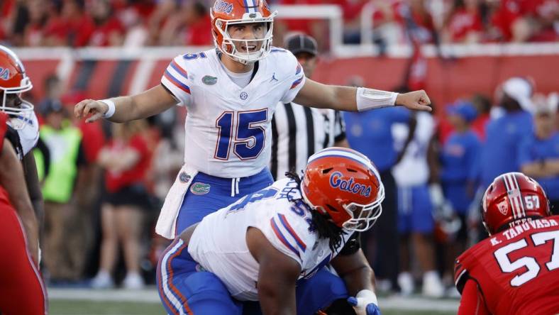 Aug 31, 2023; Salt Lake City, Utah, USA; Florida Gators quarterback Graham Mertz (15) works the line of scrimmage against the Utah Utes at Rice-Eccles Stadium. Mandatory Credit: Jeff Swinger-USA TODAY Sports