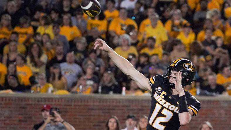 Aug 31, 2023; Columbia, Missouri, USA; Missouri Tigers quarterback Brady Cook (12) throws a pass against the South Dakota Coyotes during the first half at Faurot Field at Memorial Stadium. Mandatory Credit: Denny Medley-USA TODAY Sports