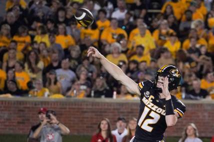 Aug 31, 2023; Columbia, Missouri, USA; Missouri Tigers quarterback Brady Cook (12) throws a pass against the South Dakota Coyotes during the first half at Faurot Field at Memorial Stadium. Mandatory Credit: Denny Medley-USA TODAY Sports