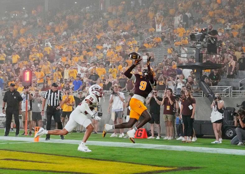 Aug 31, 2023; Tempe, Arizona, USA; Arizona State Sun Devils wide receiver Troy Omeire (9) makes a touchdown catch over Southern Utah Thunderbirds cornerback Jehvonn Lewis (26) during a dust storm in the first half at Mountain America Stadium. Mandatory Credit: Rob Schumacher-Arizona Republic