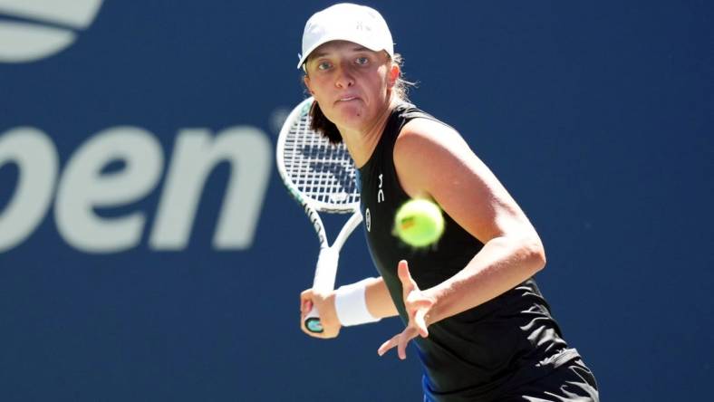 Sep 1, 2023; Flushing, NY, USA; Iga Swiatek of Poland hits to Kaja Juvan of Slovenia on day five of the 2023 U.S. Open tennis tournament at USTA Billie Jean King National Tennis Center. Mandatory Credit: Danielle Parhizkaran-USA TODAY Sports