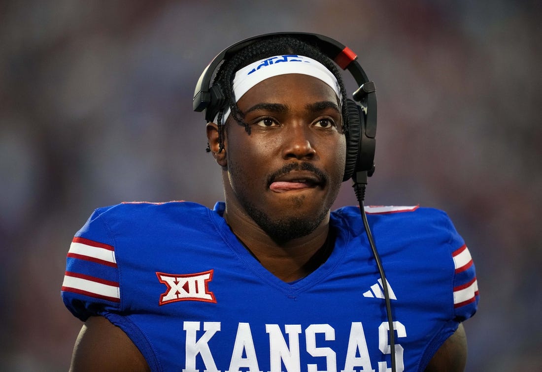 Sep 1, 2023; Lawrence, Kansas, USA; Kansas Jayhawks quarterback Jalon Daniels (6) during a timeout in the first half against the Missouri State Bears at David Booth Kansas Memorial Stadium. Mandatory Credit: Jay Biggerstaff-USA TODAY Sports