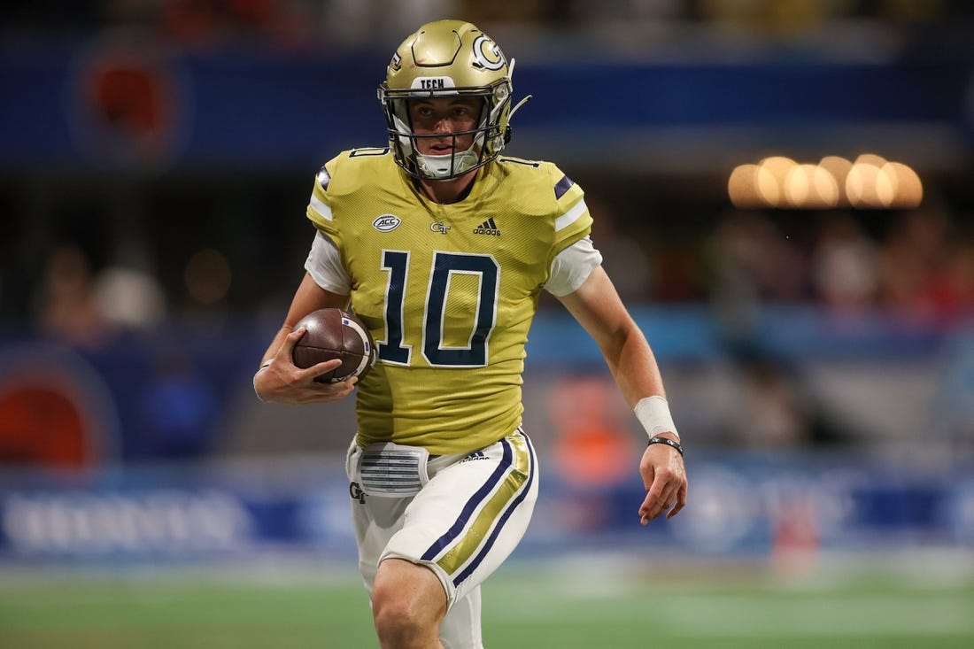 Sep 1, 2023; Atlanta, Georgia, USA; Georgia Tech Yellow Jackets quarterback Haynes King (10) runs the ball against the Louisville Cardinals in the fourth quarter at Mercedes-Benz Stadium. Mandatory Credit: Brett Davis-USA TODAY Sports