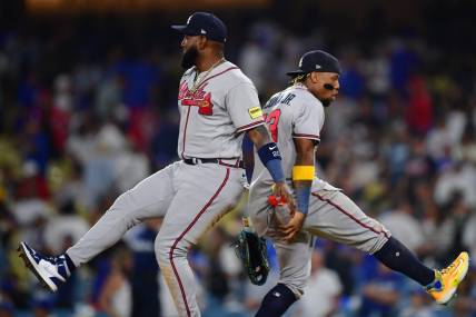 September 1, 2023; Los Angeles, California, USA; Atlanta Braves designated hitter Marcell Ozuna (20) and right fielder Ronald Acuna Jr. (13) celebrate the victory against the Los Angeles Dodgers at Dodger Stadium. Mandatory Credit: Gary A. Vasquez-USA TODAY Sports
