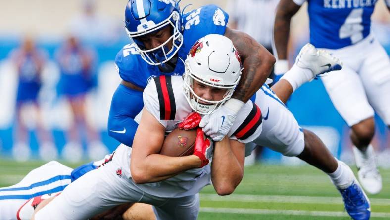 Sep 2, 2023; Lexington, Kentucky, USA; Ball State Cardinals tight end Tanner Koziol (88) is tackled by Kentucky Wildcats linebacker Trevin Wallace (32) during the first quarter at Kroger Field. Mandatory Credit: Jordan Prather-USA TODAY Sports