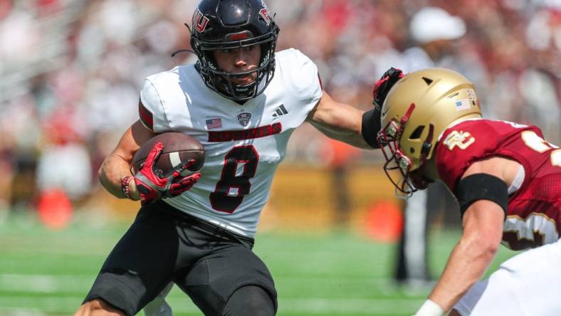Sep 2, 2023; Chestnut Hill, Massachusetts, USA; Northern Illinois Huskies receiver Kacper Rutkiewicz (8) runs the ball during the first half against the Boston College Eagles at Alumni Stadium. Mandatory Credit: Paul Rutherford-USA TODAY Sports