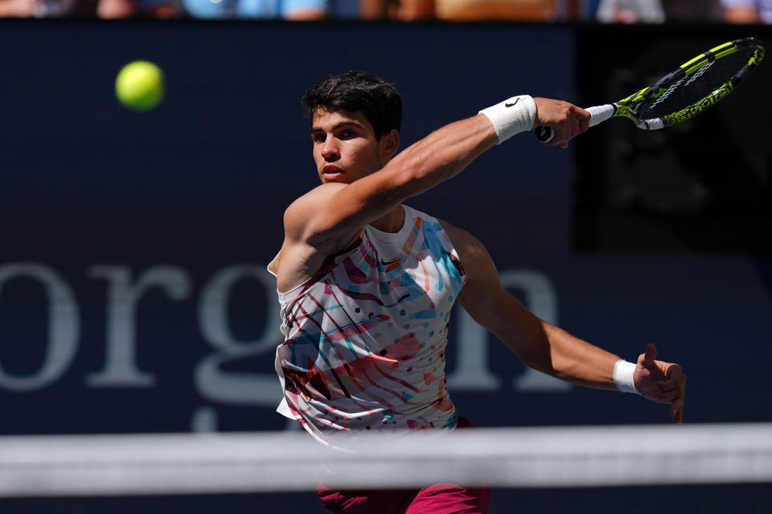 Sep 2, 2023; Flushing, NY, USA; Carlos Alcaraz of Spain hits to Daniel Evans of Great Britain on day six of the 2023 U.S. Open tennis tournament at USTA Billie Jean King National Tennis Center. Mandatory Credit: Danielle Parhizkaran-USA TODAY Sports