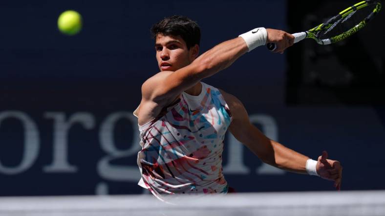 Sep 2, 2023; Flushing, NY, USA; Carlos Alcaraz of Spain hits to Daniel Evans of Great Britain on day six of the 2023 U.S. Open tennis tournament at USTA Billie Jean King National Tennis Center. Mandatory Credit: Danielle Parhizkaran-USA TODAY Sports