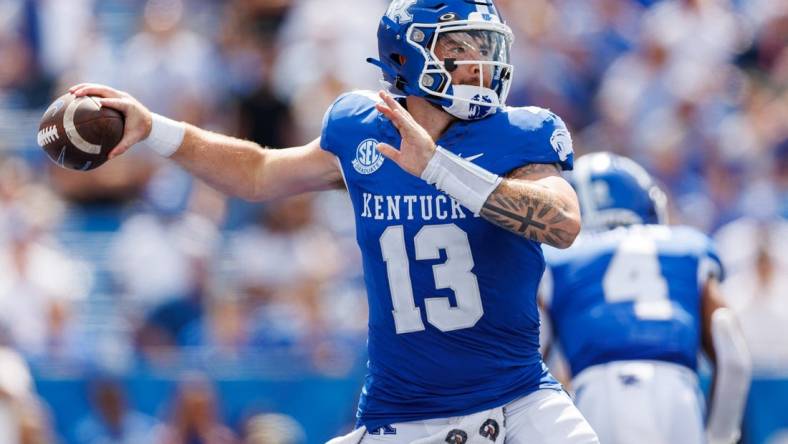 Sep 2, 2023; Lexington, Kentucky, USA; Kentucky Wildcats quarterback Devin Leary (13) throws a pass during the fourth quarter against the Ball State Cardinals at Kroger Field. Mandatory Credit: Jordan Prather-USA TODAY Sports