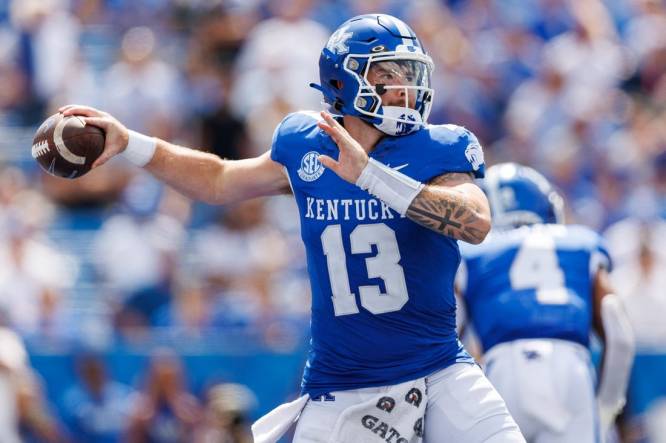 Sep 2, 2023; Lexington, Kentucky, USA; Kentucky Wildcats quarterback Devin Leary (13) throws a pass during the fourth quarter against the Ball State Cardinals at Kroger Field. Mandatory Credit: Jordan Prather-USA TODAY Sports