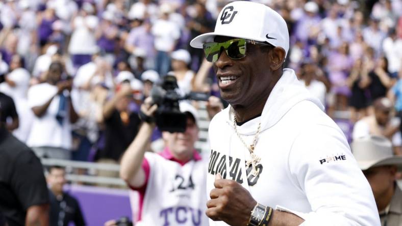 Sep 2, 2023; Fort Worth, Texas, USA; Colorado Buffaloes head coach Deion Sanders runs on the field before the game against the TCU Horned Frogs at Amon G. Carter Stadium. Mandatory Credit: Tim Heitman-USA TODAY Sports
