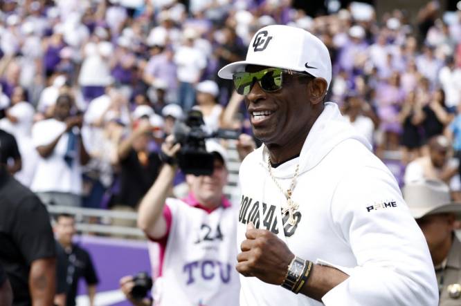 Sep 2, 2023; Fort Worth, Texas, USA; Colorado Buffaloes head coach Deion Sanders runs on the field before the game against the TCU Horned Frogs at Amon G. Carter Stadium. Mandatory Credit: Tim Heitman-USA TODAY Sports