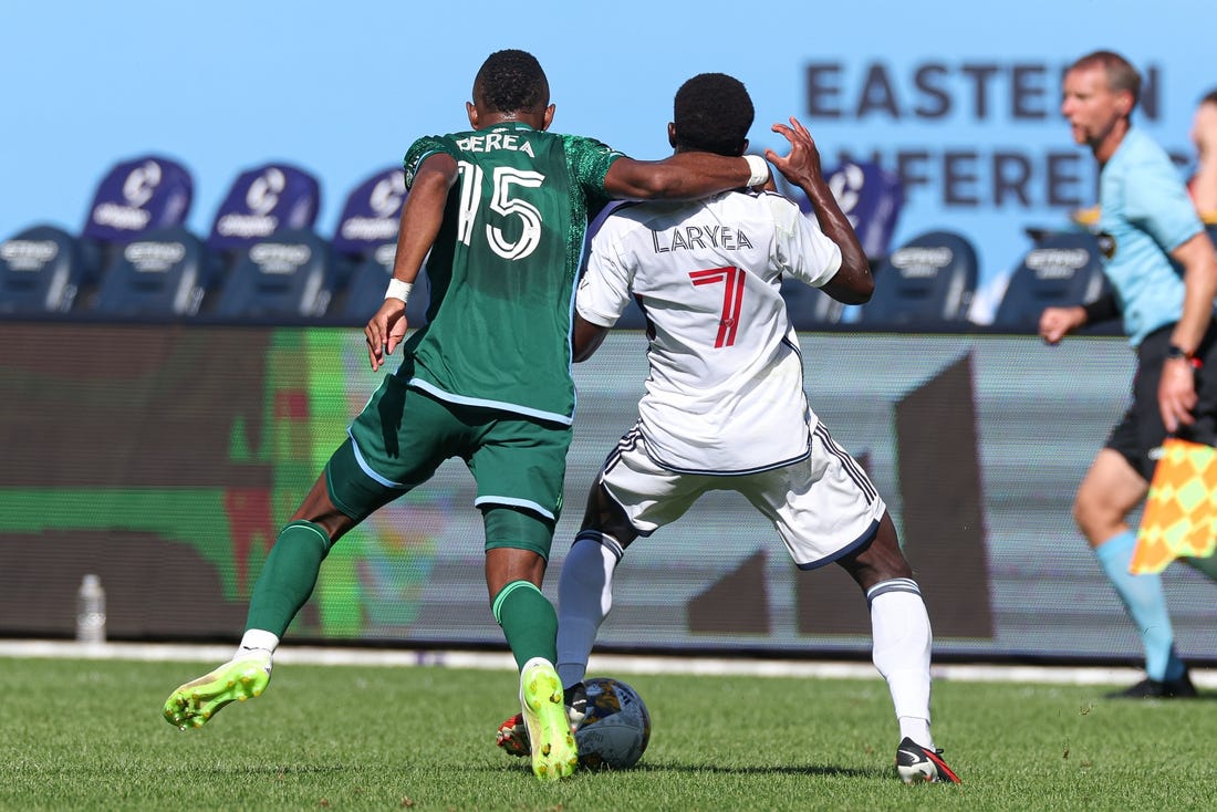 Sep 2, 2023; New York, New York, USA; New York City FC midfielder Andres Perea (15) fouls Vancouver Whitecaps forward Richie Laryea (7) during the first half at Yankee Stadium. Mandatory Credit: Vincent Carchietta-USA TODAY Sports