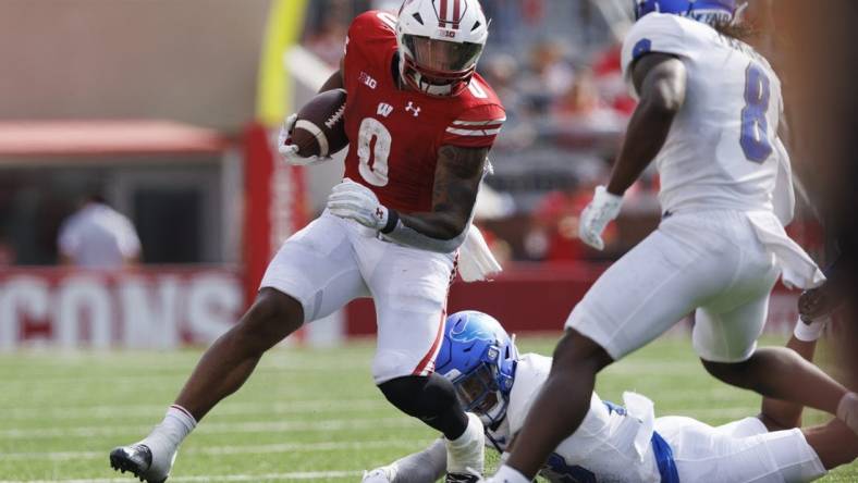 Sep 2, 2023; Madison, Wisconsin, USA;  Wisconsin Badgers running back Braelon Allen (0) rushes with the football during the second quarter against the Buffalo Bulls at Camp Randall Stadium. Mandatory Credit: Jeff Hanisch-USA TODAY Sports