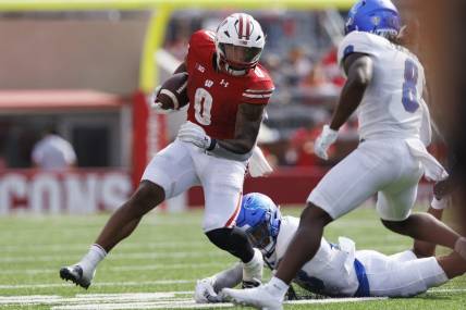 Sep 2, 2023; Madison, Wisconsin, USA;  Wisconsin Badgers running back Braelon Allen (0) rushes with the football during the second quarter against the Buffalo Bulls at Camp Randall Stadium. Mandatory Credit: Jeff Hanisch-USA TODAY Sports