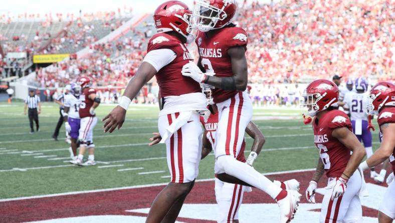 Sep 2, 2023; Little Rock, Arkansas, USA; Arkansas Razorbacks quarterback KJ Jefferson (1) and wide receiver Andrew Armstrong (2) celebrate after a touchdown against the Western Carolina Catamounts at War Memorial Stadium. Arkansas won 56-13. Mandatory Credit: Nelson Chenault-USA TODAY Sports