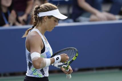 Sep 2, 2023; Flushing, NY, USA; Lucia Bronzetti of Italy adjusts her strings between points against Qinwen Zheng of China (not pictured) on day six of the 2023 U.S. Open tennis tournament at USTA Billie Jean King National Tennis Center. Mandatory Credit: Geoff Burke-USA TODAY Sports