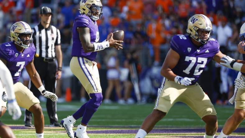 Sep 2, 2023; Seattle, Washington, USA; Washington Huskies quarterback Michael Penix Jr. (9) looks to pass against the Boise State Broncos during the fourth quarter at Alaska Airlines Field at Husky Stadium. Mandatory Credit: Joe Nicholson-USA TODAY Sports