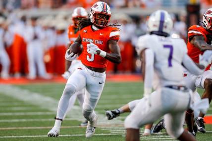 Sep 2, 2023; Stillwater, Oklahoma, USA; Oklahoma State's Kendal Daniels (5) returns a recovered a fumble against Central Arkansas in the second quarter at Boone Pickens Stadium. Mandatory Credit: Nathan J. Fish-USA TODAY Sports