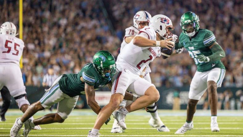 Sep 2, 2023; New Orleans, Louisiana, USA;  South Alabama Jaguars quarterback Carter Bradley (2) scrambles out the pocket to avoid the sack of Tulane Green Wave safety Kam Pedescleaux (8) during the first half at Yulman Stadium. Mandatory Credit: Stephen Lew-USA TODAY Sports