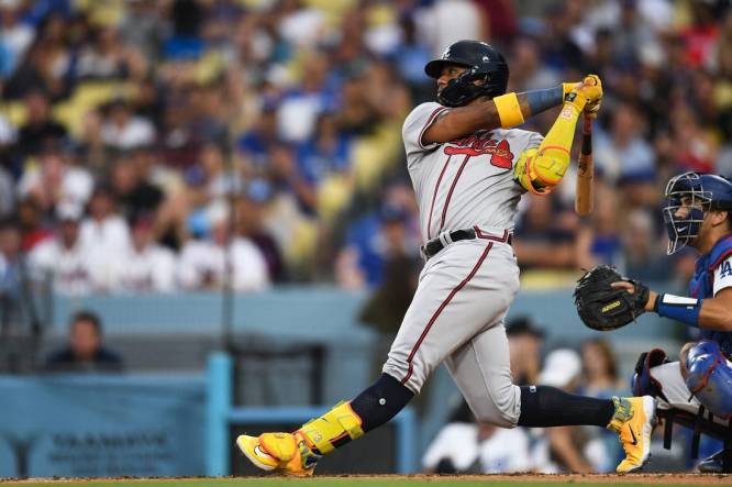 Sep 2, 2023; Los Angeles, California, USA; Atlanta Braves right fielder Ronald Acuna Jr. (13) hits a home run against the Los Angeles Dodgers during the third inning at Dodger Stadium. Mandatory Credit: Jonathan Hui-USA TODAY Sports
