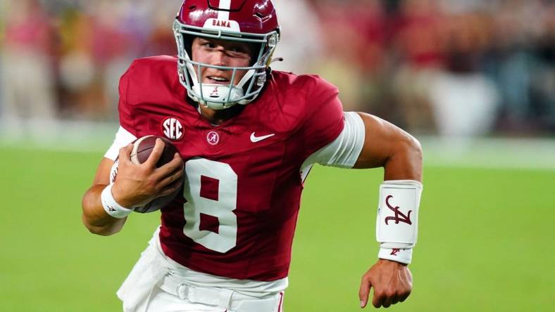 Sep 2, 2023; Tuscaloosa, Alabama, USA; Alabama Crimson Tide quarterback Tyler Buchner (8) scrambles up the field against the Middle Tennessee Blue Raiders during the second half at Bryant-Denny Stadium. Mandatory Credit: John David Mercer-USA TODAY Sports