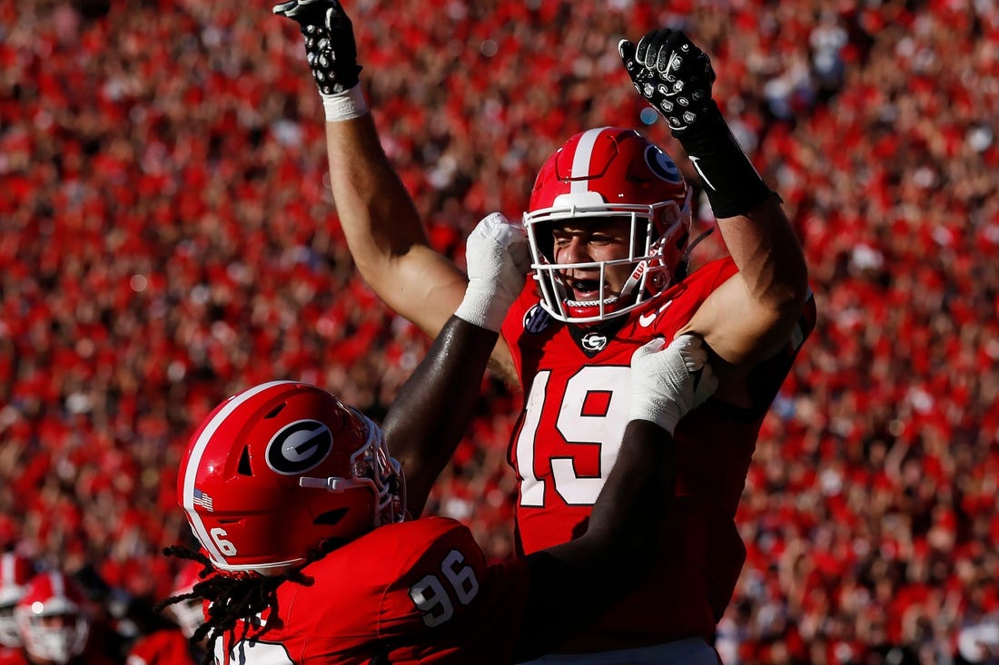 Georgia tight end Brock Bowers (19) celebrates with his teammates after scoring a touchdown during the first half of a NCAA college football game against Tennessee Martin in Athens, Ga., on Saturday, Sept. 2, 2023.