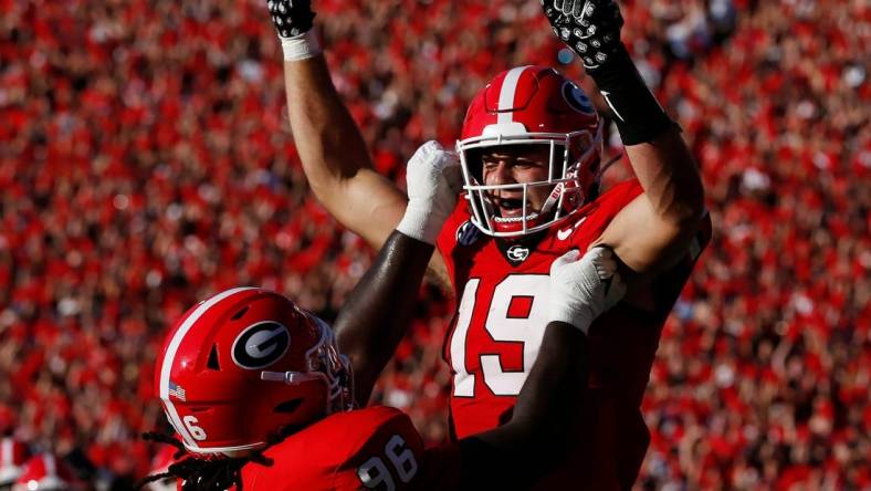 Georgia tight end Brock Bowers (19) celebrates with his teammates after scoring a touchdown during the first half of a NCAA college football game against Tennessee Martin in Athens, Ga., on Saturday, Sept. 2, 2023.