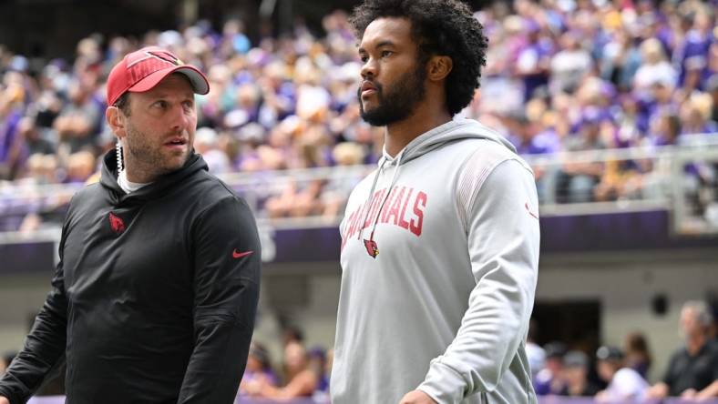 Aug 26, 2023; Minneapolis, Minnesota, USA; Arizona Cardinals quarterback Kyler Murray (right) walks onto the field at  U.S. Bank Stadium before the game between the Minnesota Vikings and the Arizona Cardinals. Mandatory Credit: Jeffrey Becker-USA TODAY Sports