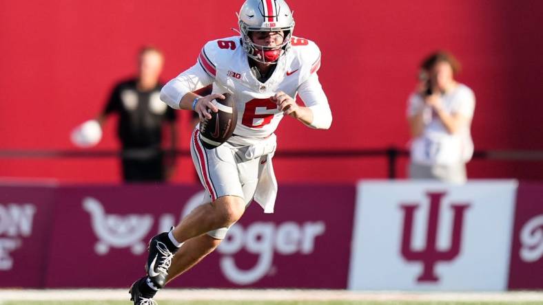 Sep 2, 2023; Bloomington, Indiana, USA; Ohio State Buckeyes quarterback Kyle McCord (6) scrambles during the NCAA football game at Indiana University Memorial Stadium. Ohio State won 23-3.