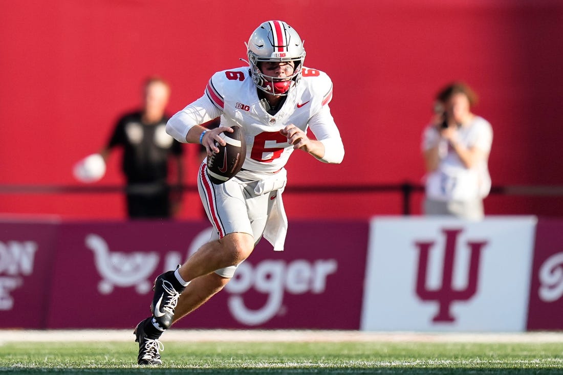 Sep 2, 2023; Bloomington, Indiana, USA; Ohio State Buckeyes quarterback Kyle McCord (6) scrambles during the NCAA football game at Indiana University Memorial Stadium. Ohio State won 23-3.