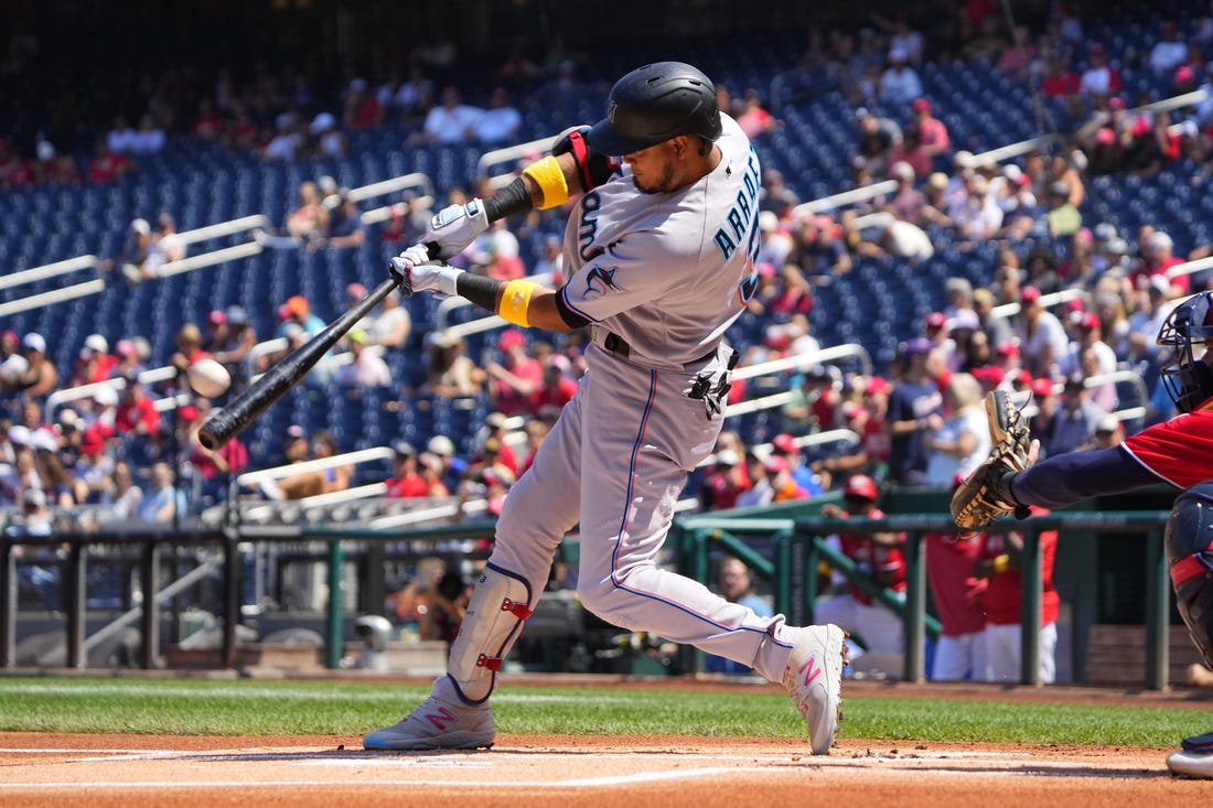 Sep 3, 2023; Washington, District of Columbia, USA;  Miami Marlins second baseman Luis Arraez (3) hits a home run against the Washington Nationals during the first inning at Nationals Park. Mandatory Credit: Gregory Fisher-USA TODAY Sports