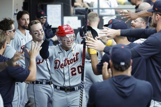 Sep 3, 2023; Chicago, Illinois, USA; Detroit Tigers first baseman Spencer Torkelson (20) celebrates with teammates after hitting a solo home run against the Chicago White Sox during the seventh inning at Guaranteed Rate Field. Mandatory Credit: Kamil Krzaczynski-USA TODAY Sports