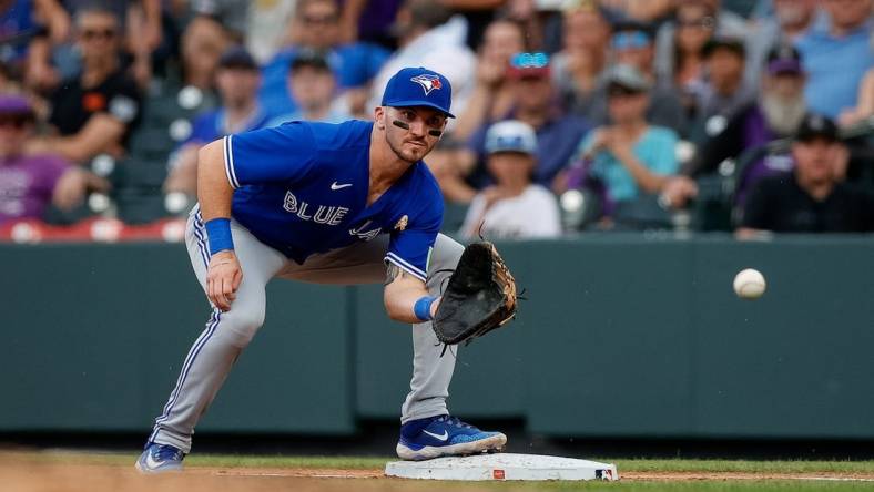 Sep 3, 2023; Denver, Colorado, USA; Toronto Blue Jays first baseman Spencer Horwitz (48) fields a throw to first in the fourth inning against the Colorado Rockies at Coors Field. Mandatory Credit: Isaiah J. Downing-USA TODAY Sports