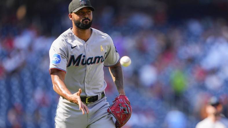 Sep 3, 2023; Washington, District of Columbia, USA;  Miami Marlins pitcher Sandy Alcantara (22) tosses to first base to record an out against the Washington Nationals during the sixth inning at Nationals Park. Mandatory Credit: Gregory Fisher-USA TODAY Sports